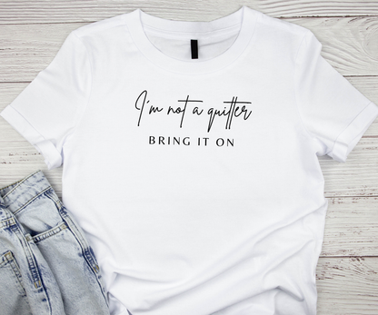 T-Shirt — "I'm Not a Quitter, Bring It On" Motivational Graphic Tee Printify Pikolelie T-Shirt